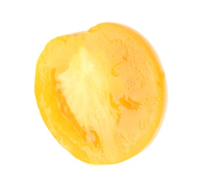 Photo of Slice of yellow tomato on white background