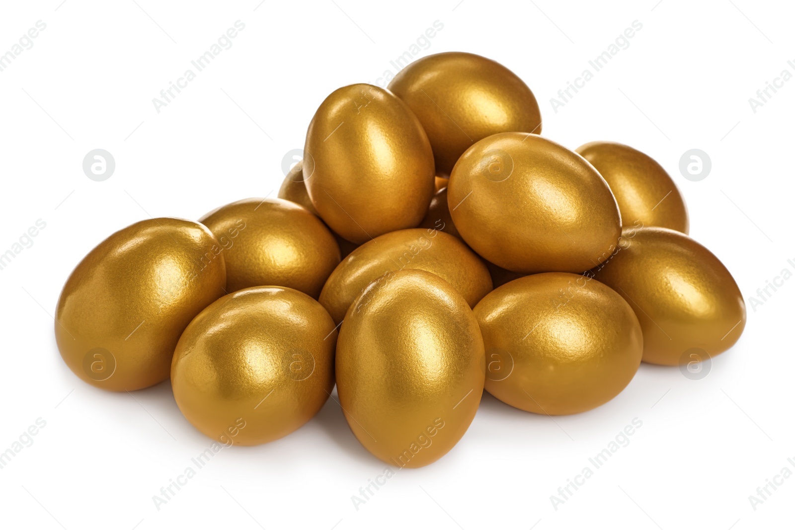 Photo of Many shiny golden eggs on white background