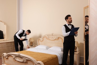 Photo of Men attending professional butler courses in hotel