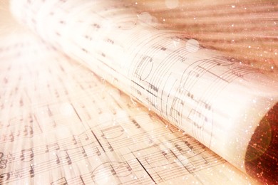 Image of Sheets with music notes, closeup. Bokeh and color tone effects