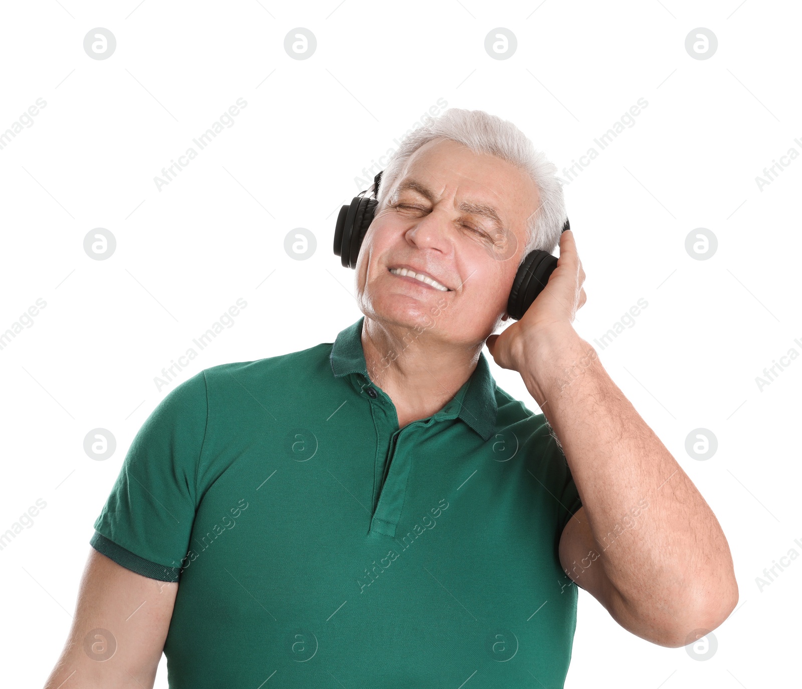 Photo of Mature man enjoying music in headphones on white background