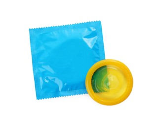 Photo of Package with condoms on white background, top view. Safe sex
