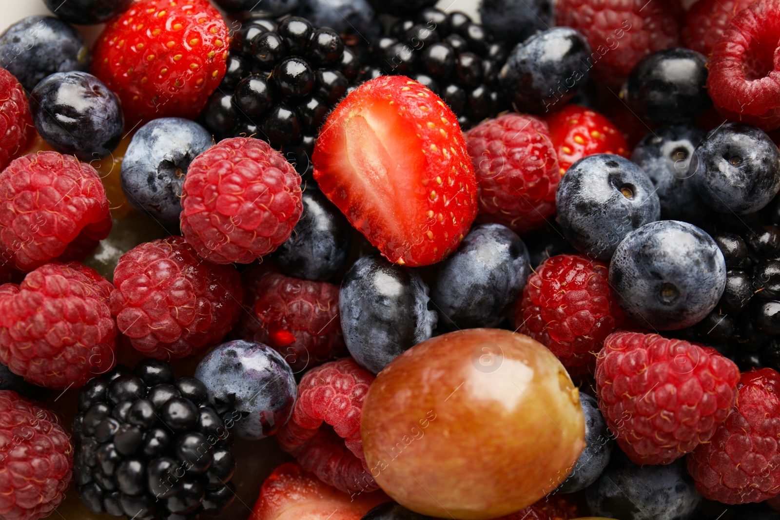 Photo of Fresh tasty fruit salad as background, top view