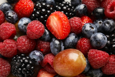 Photo of Fresh tasty fruit salad as background, top view