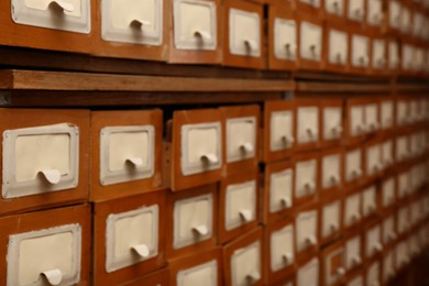 Photo of Blurred view of library card catalog drawers