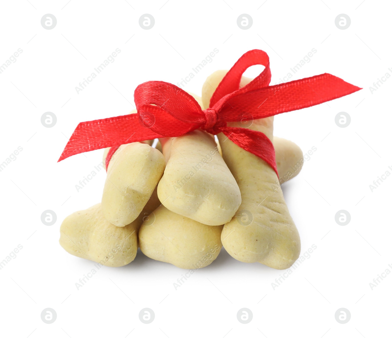 Photo of Bone shaped dog cookies with red bow on white background