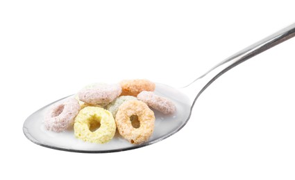 Photo of Cereal rings and milk in spoon isolated on white