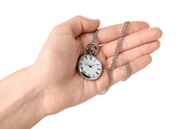 Woman holding pocket clock with chain on white background, closeup