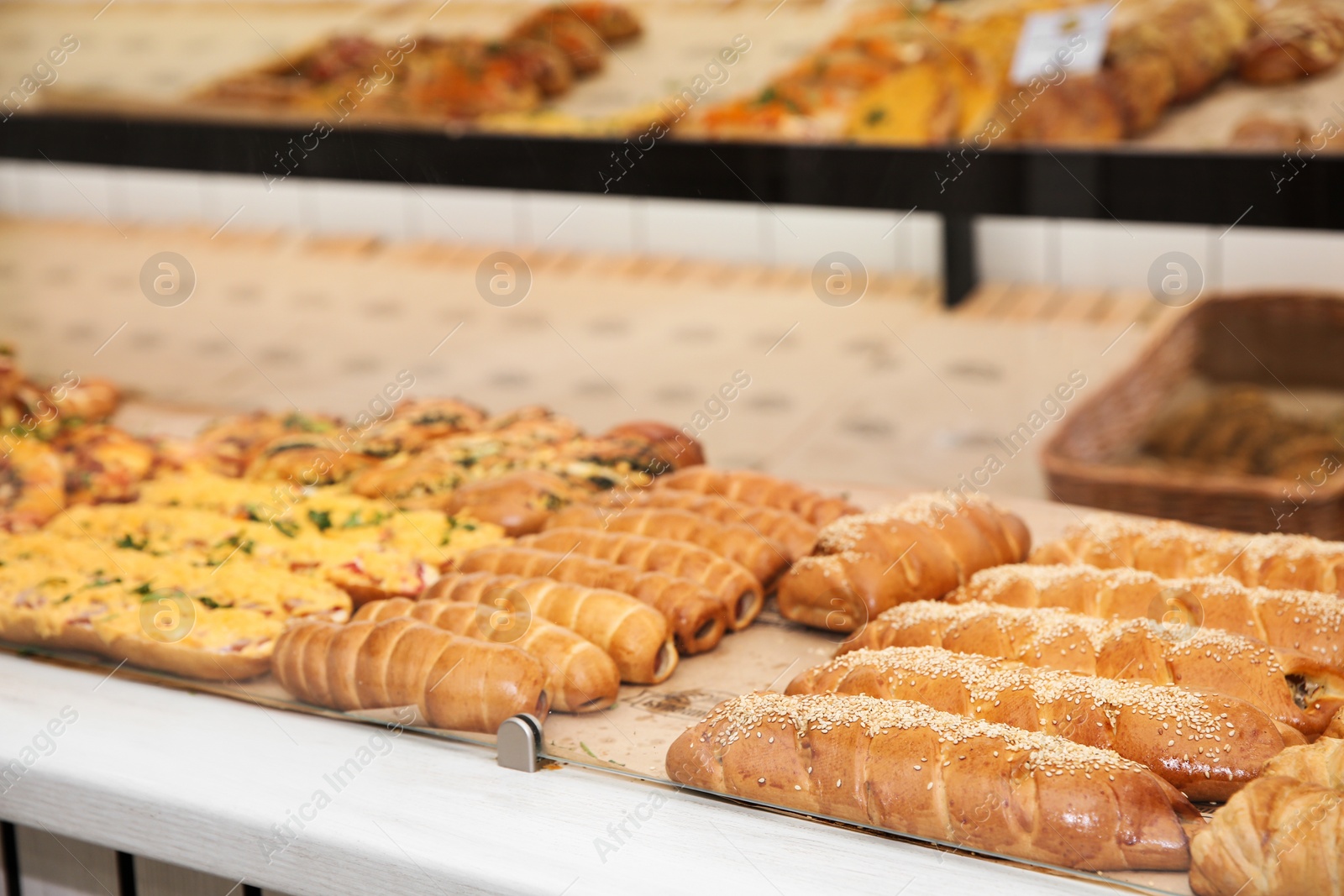 Photo of Fresh pastries on counter in bakery store