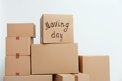 Pile of moving boxes on white background