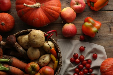 Photo of Different fresh ripe vegetables and fruits on wooden table, flat lay