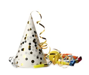 Party hat, blowers and confetti streamers on white background