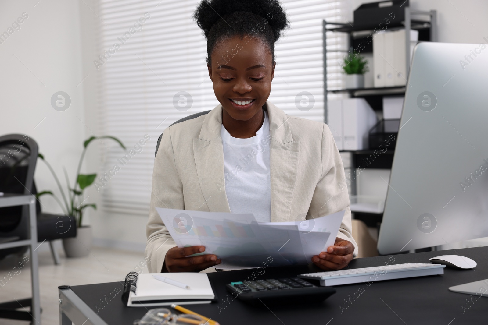 Photo of Professional accountant working at desk in office