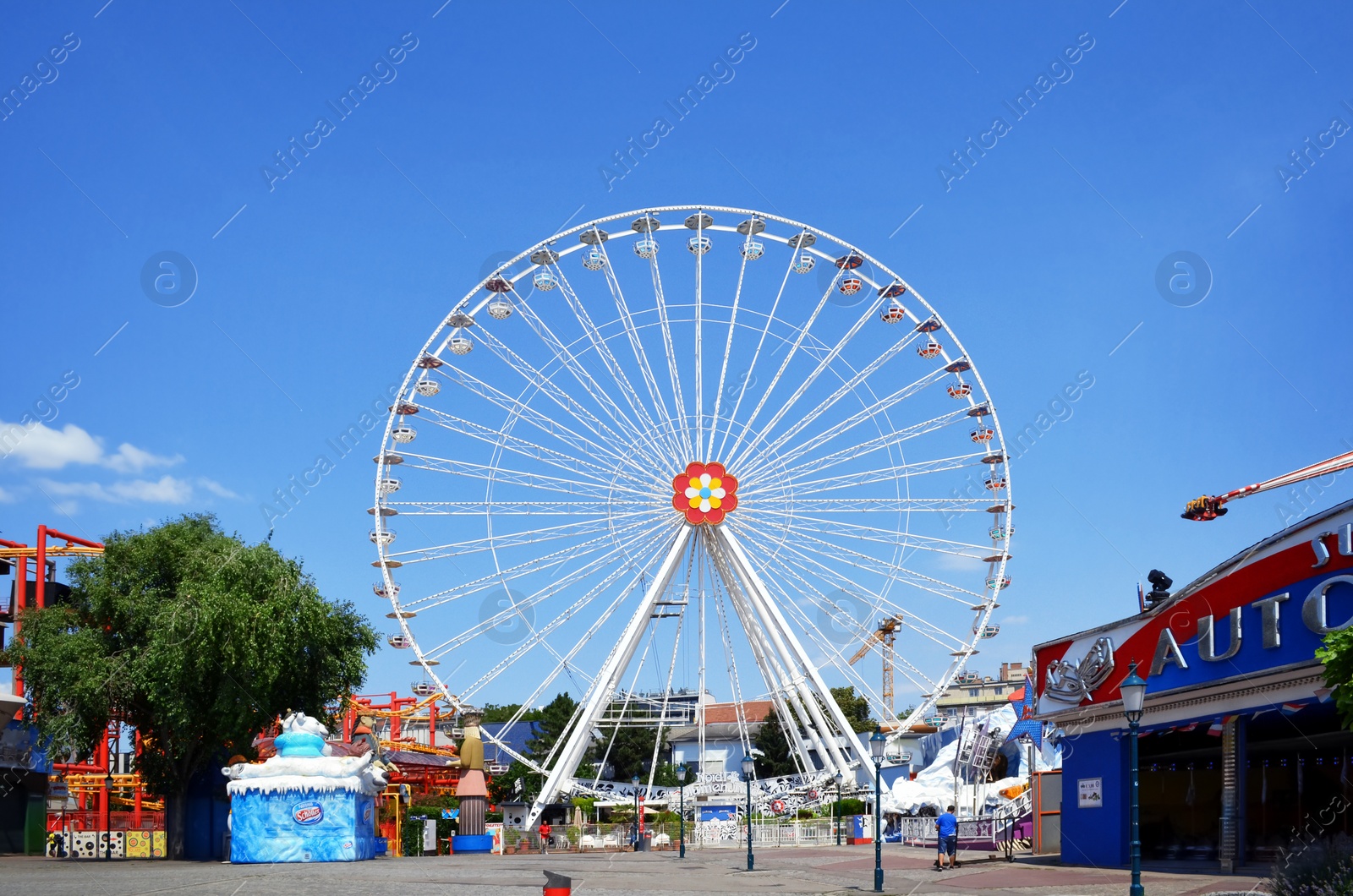 Photo of VIENNA, AUSTRIA - JUNE 18, 2018: Grand Ferris Wheel in amusement park on sunny day