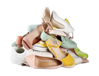 Photo of Pile of different female shoes isolated on white