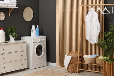 Laundry room interior with washing machine and furniture