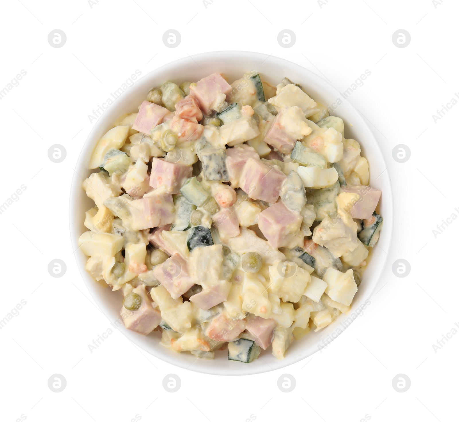 Photo of Tasty Olivier salad with boiled sausage in bowl isolated on white, top view