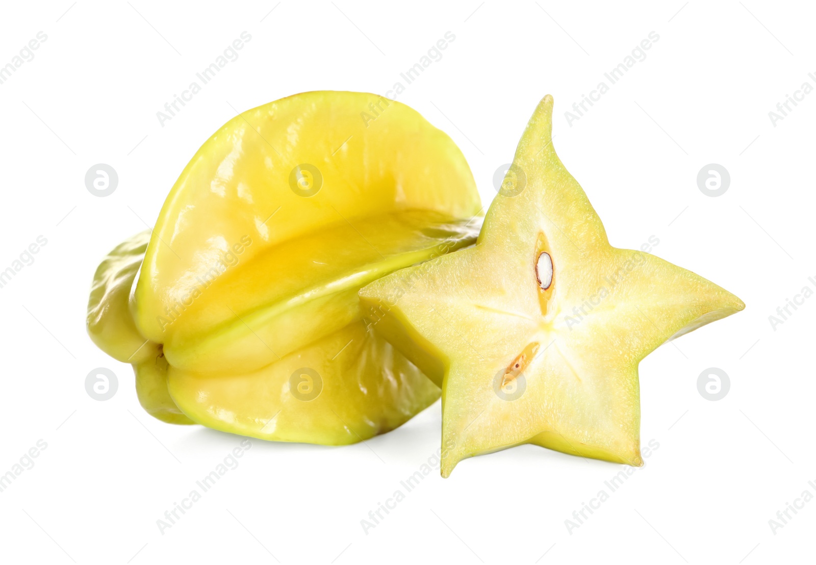 Photo of Cut and whole carambolas on white background