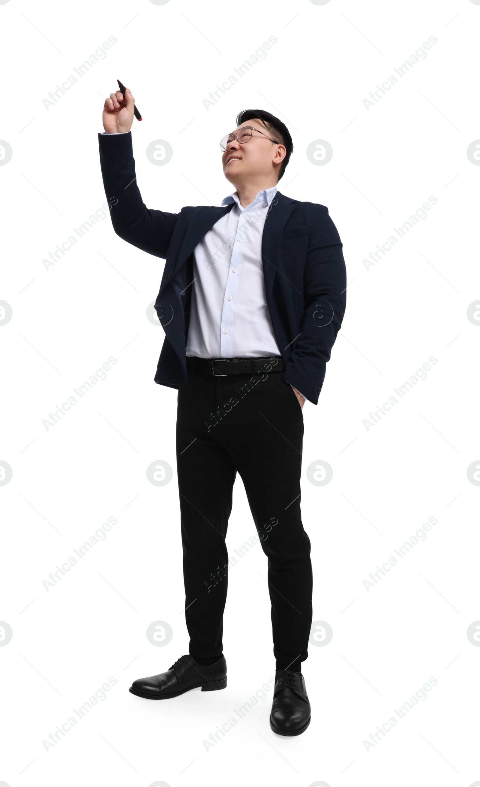 Photo of Businessman in suit with marker writing on white background, low angle view