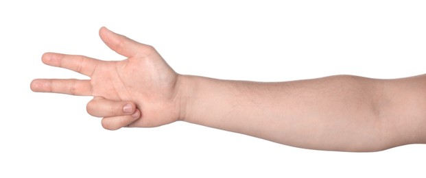 Playing rock, paper and scissors. Man making scissors with his fingers on white background, closeup