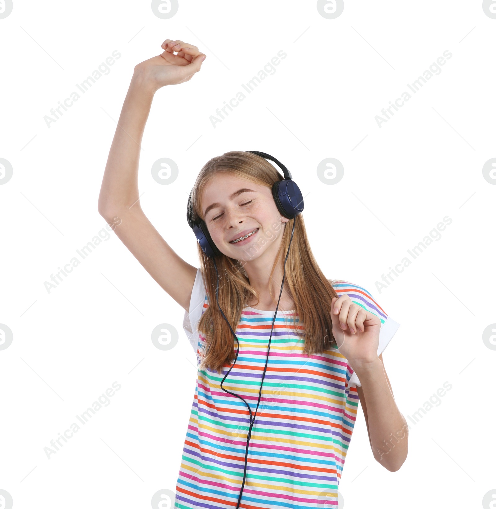 Photo of Teen girl listening to music with headphones on white background