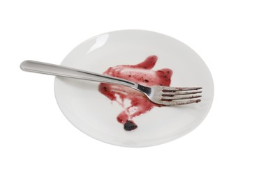 Dirty plate and fork on white background