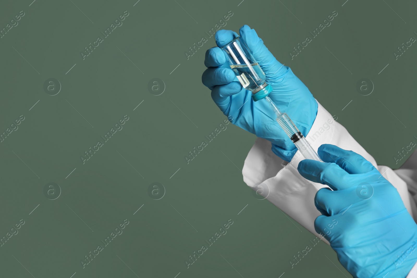 Photo of Doctor with syringe and medicine for vaccination on color background