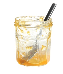 Photo of Leftovers of tasty sweet jam in glass jar on white background