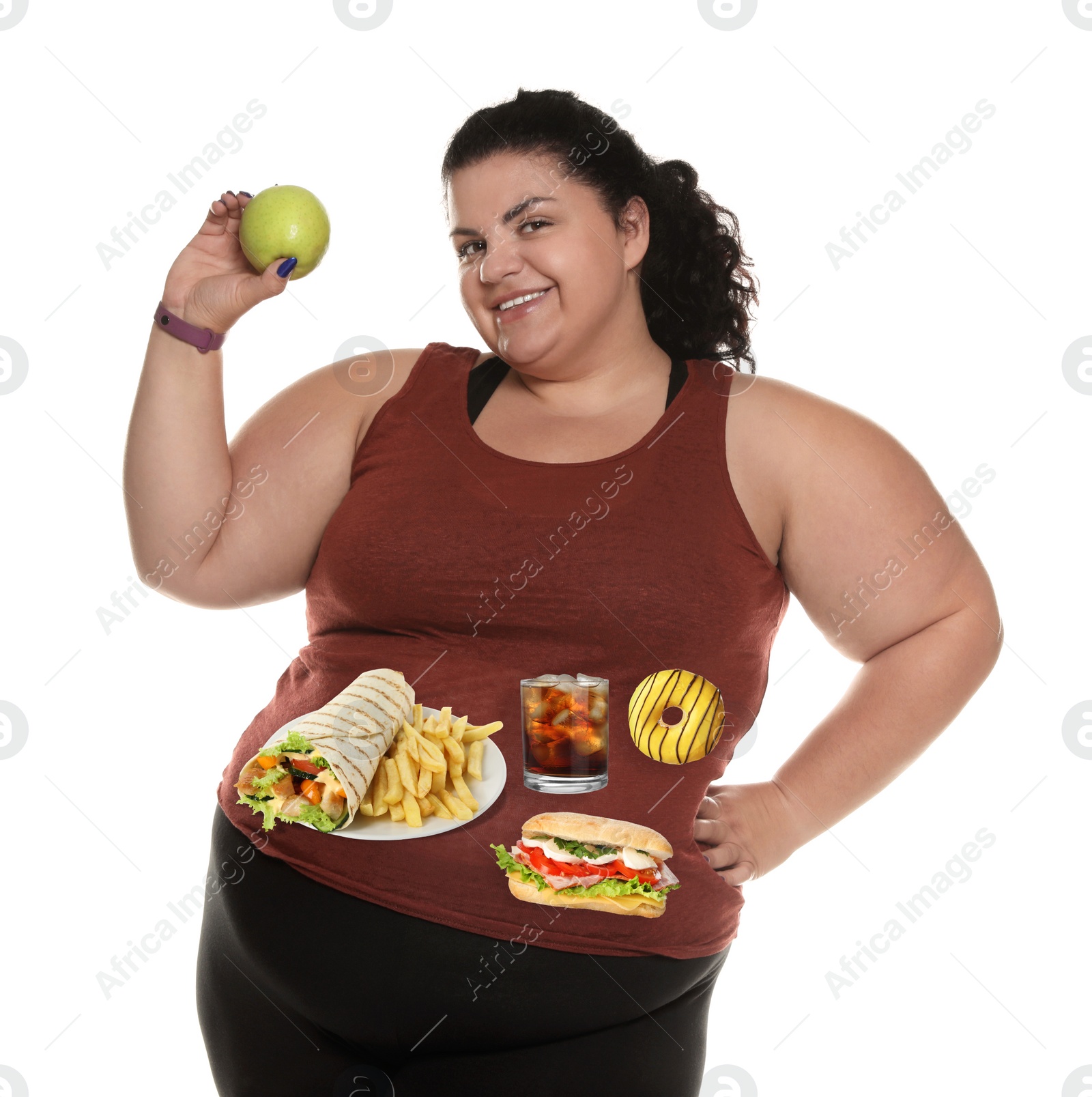 Image of Happy overweight woman with apple and images of different unhealthy food on her belly against white background