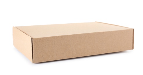 Photo of Closed cardboard box on white background. Mockup for design