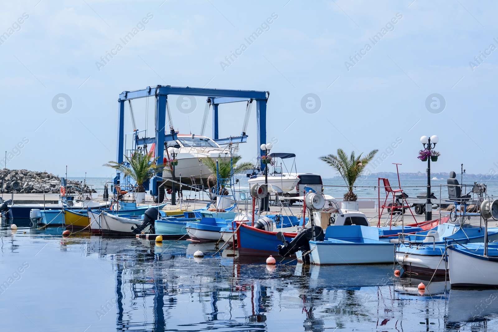 Photo of Beautiful view of city pier with moored boats on sunny day