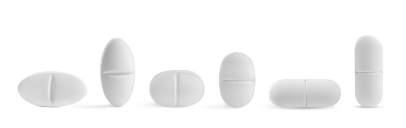 Image of Set of different pills in row isolated on white