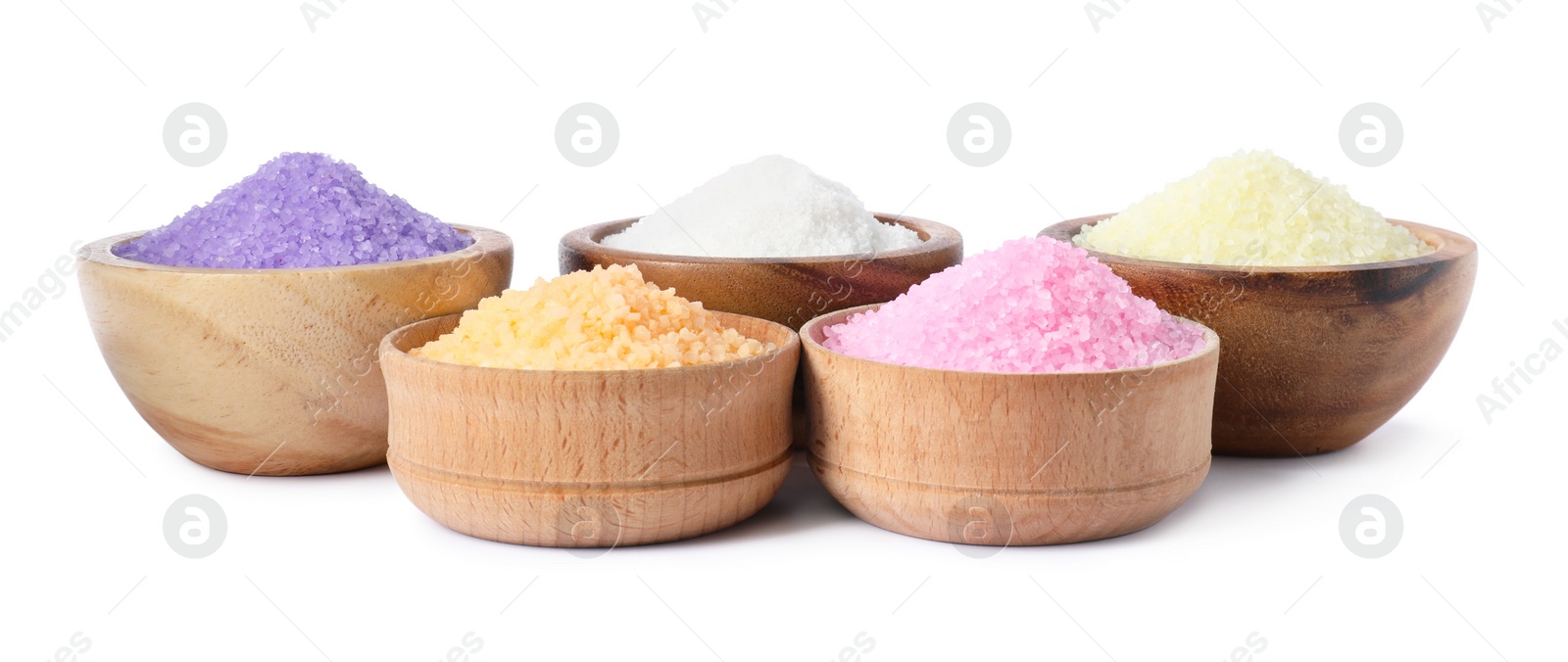 Photo of Wooden bowls with different sea salt on white background