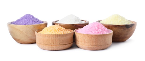 Photo of Wooden bowls with different sea salt on white background