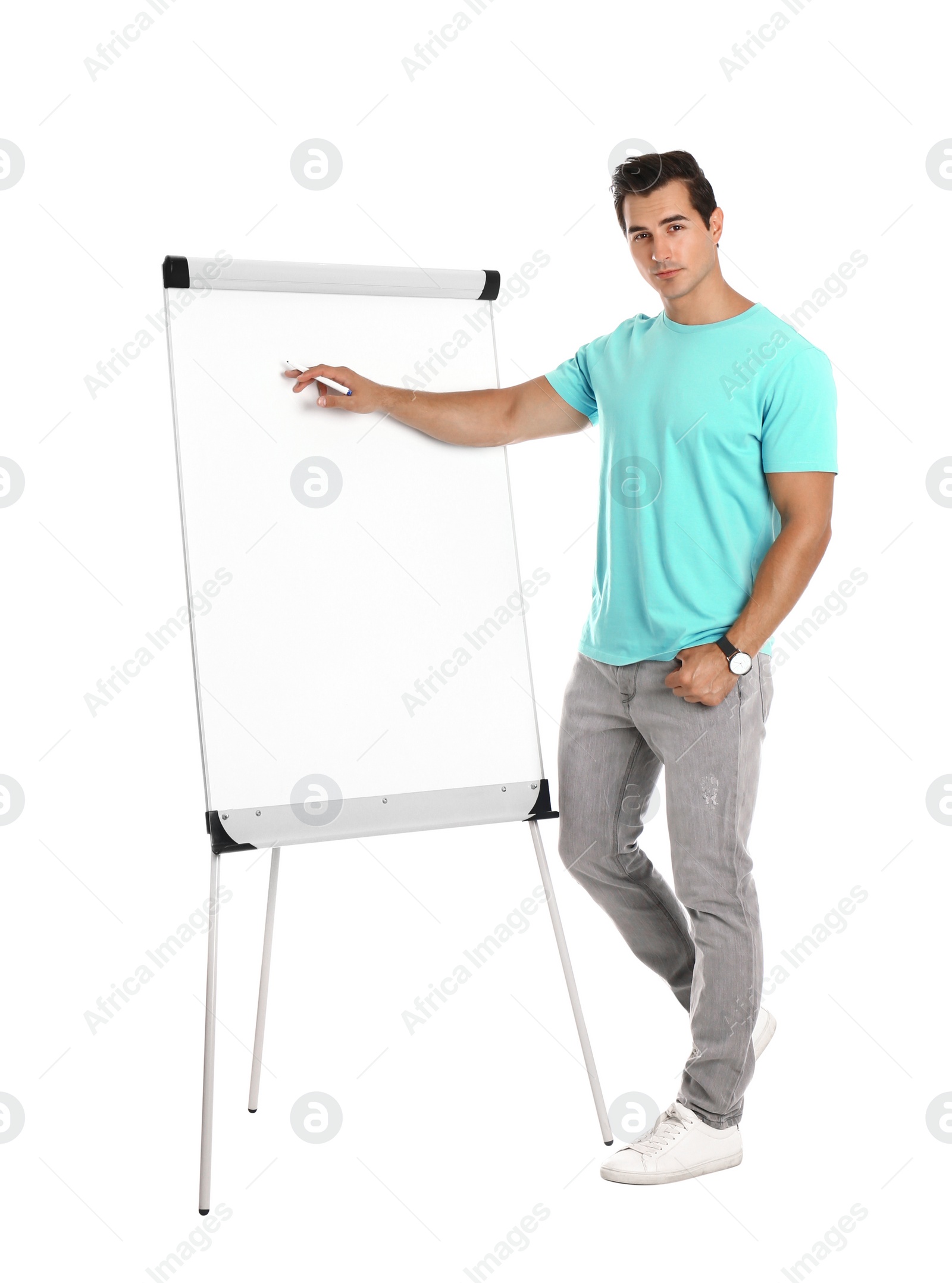 Photo of Professional business trainer near flip chart on white background