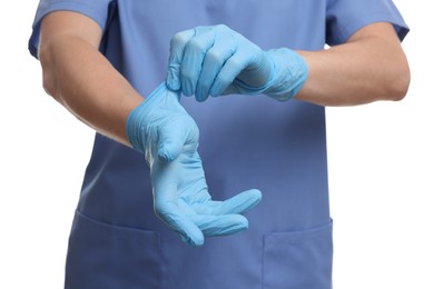 Doctor wearing light blue medical glove on white background, closeup