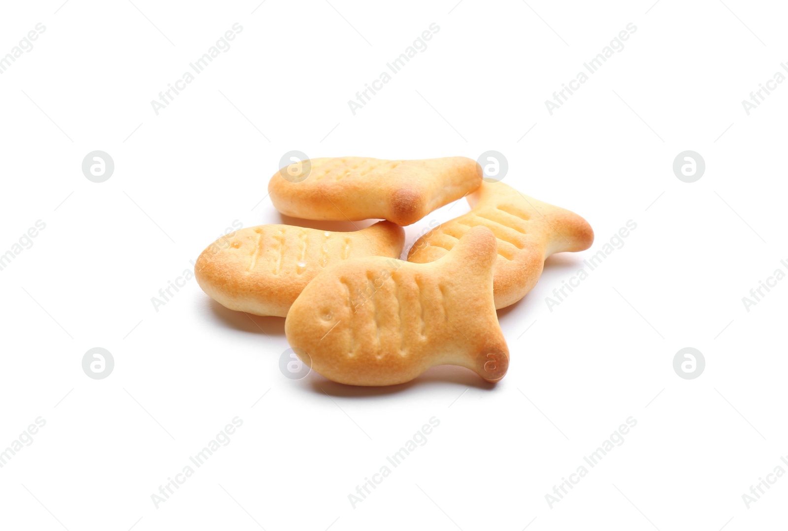 Photo of Delicious crispy goldfish crackers on white background