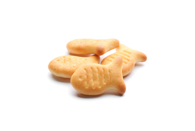 Photo of Delicious crispy goldfish crackers on white background