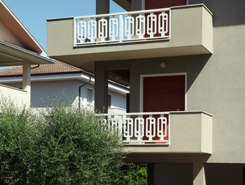 Photo of Exterior of residential building with balconies on sunny day