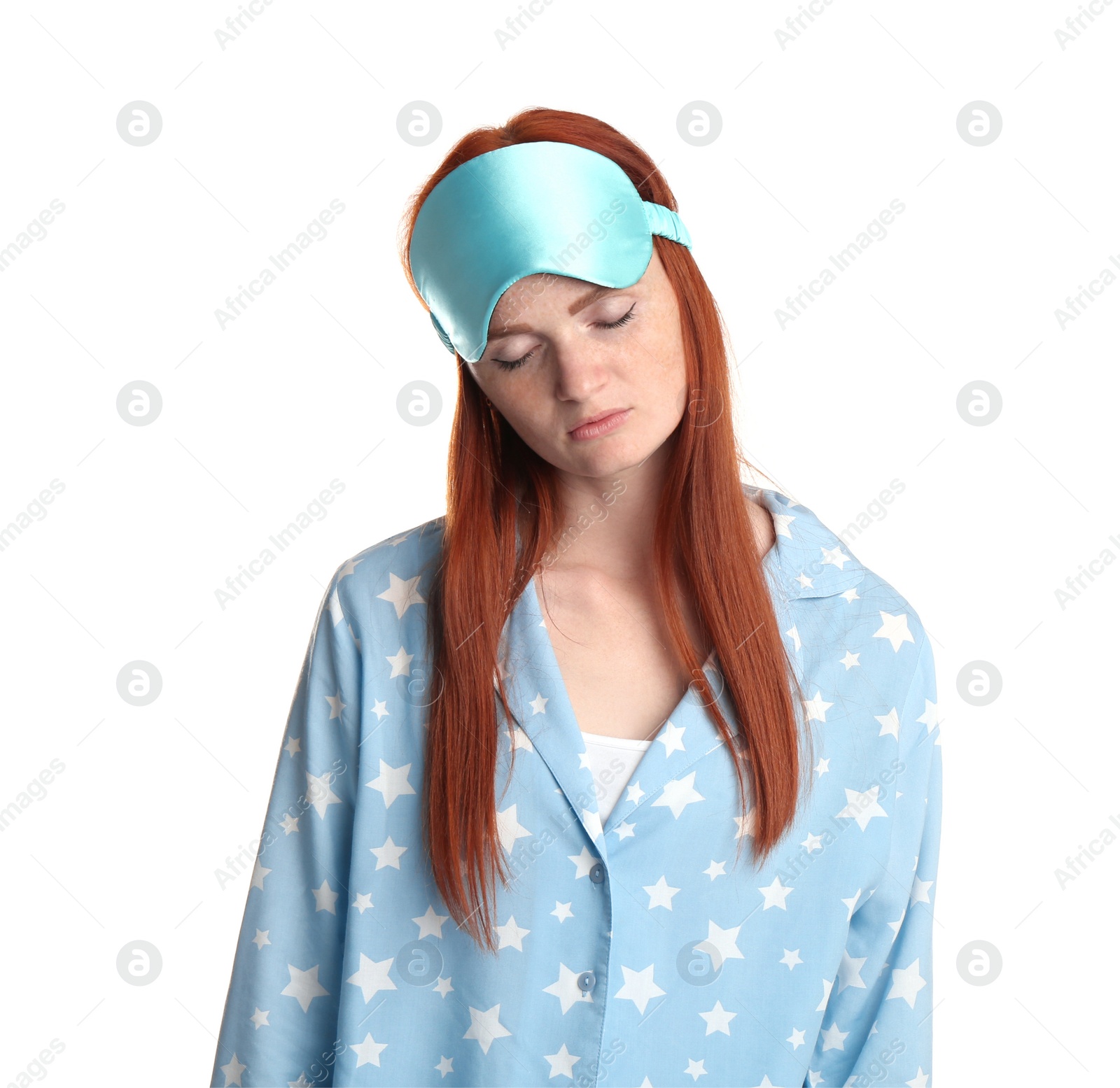 Photo of Young woman wearing pajamas and mask in sleepwalking state on white background