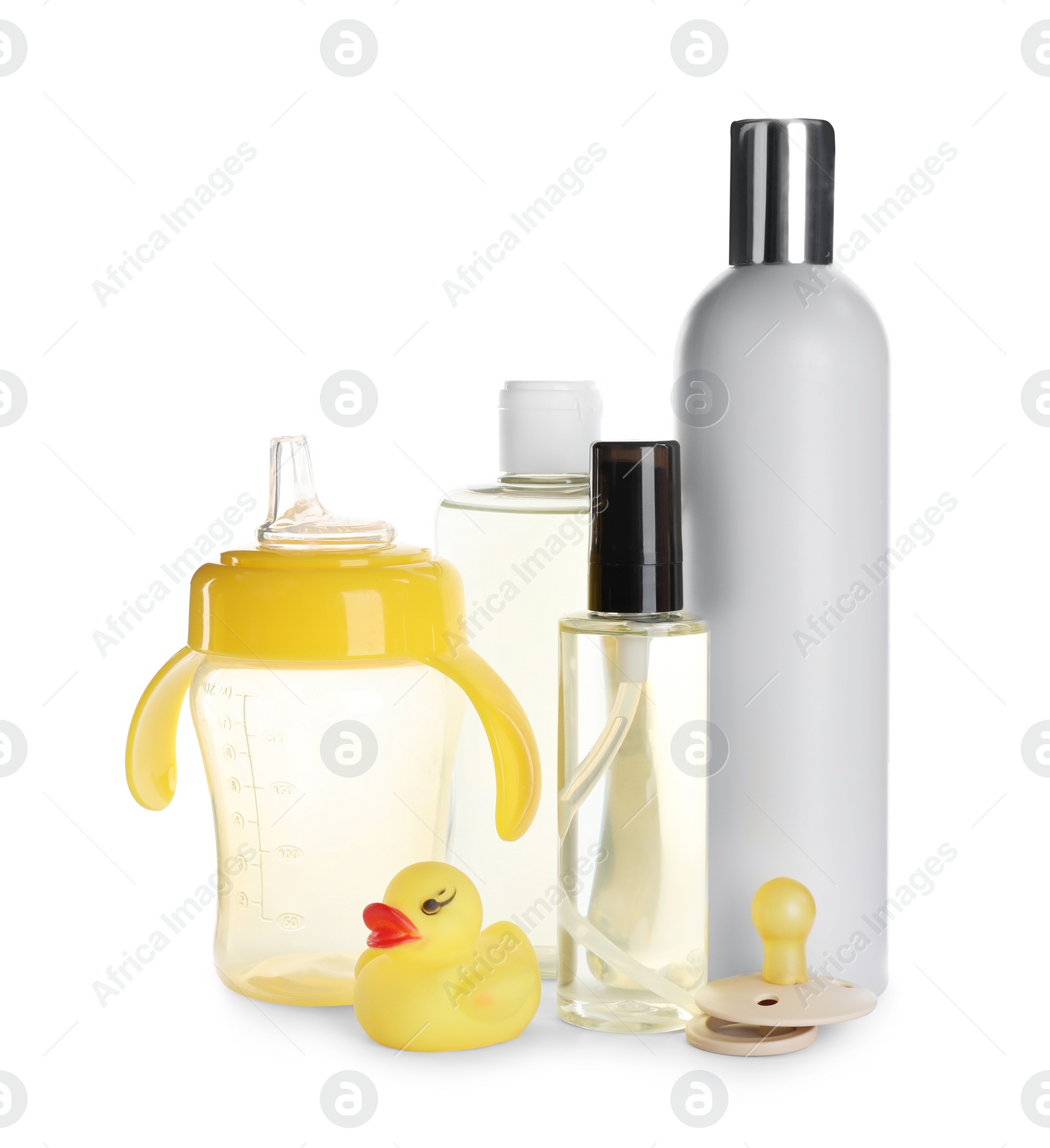 Photo of Bottles of baby oil, other cosmetic products and accessories on white background