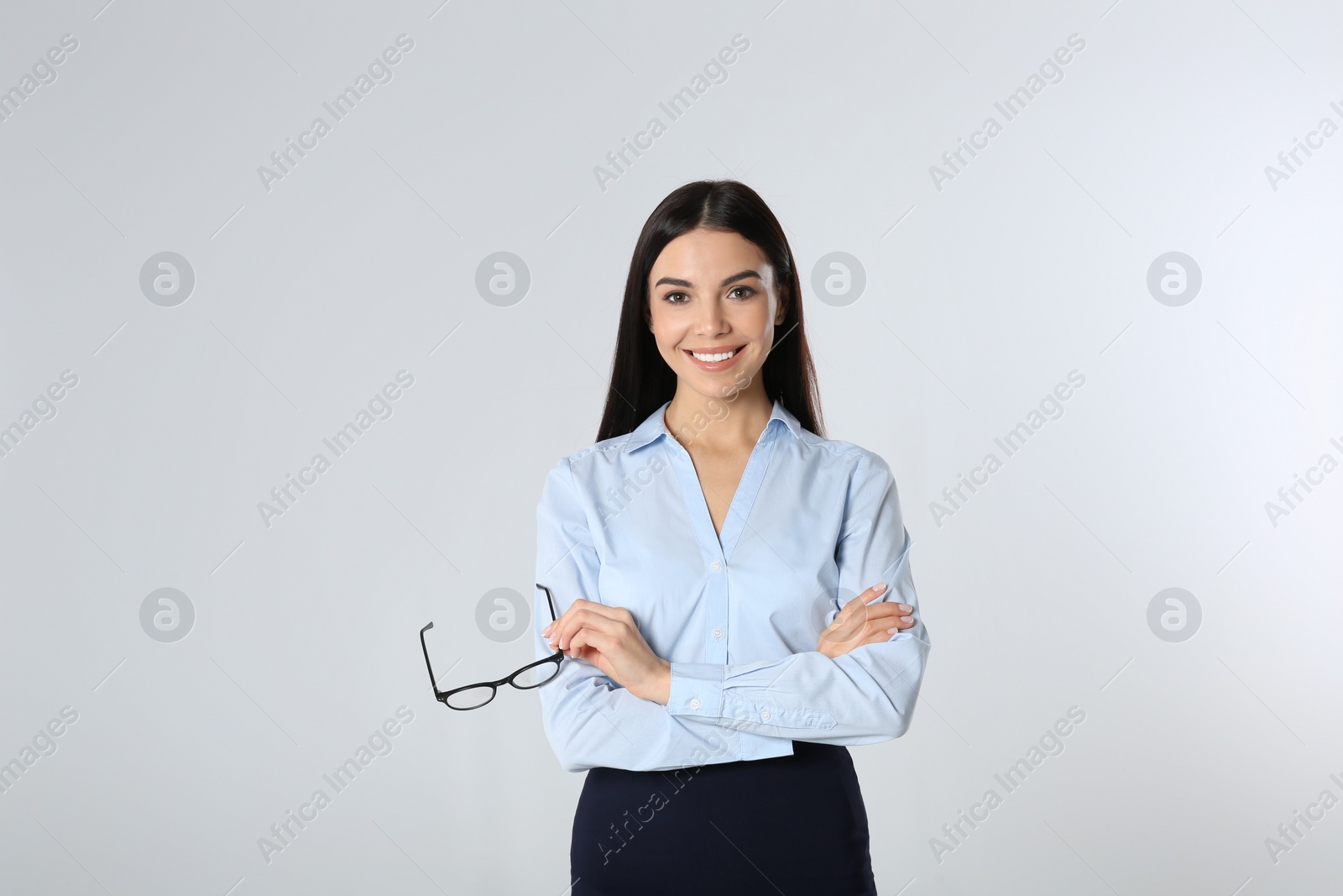 Photo of Portrait of young businesswoman on white background