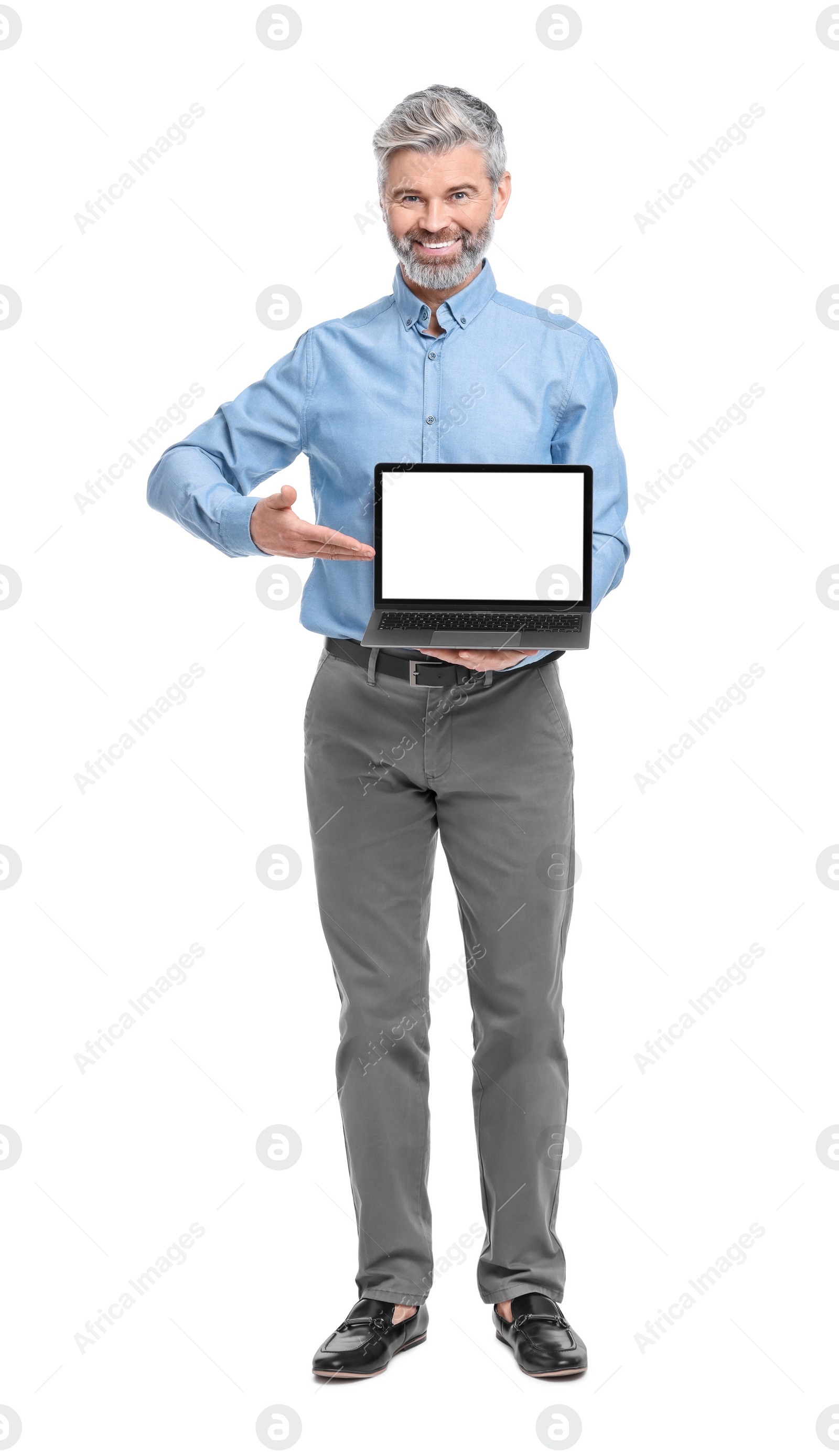 Photo of Mature businessman in stylish clothes with laptop on white background