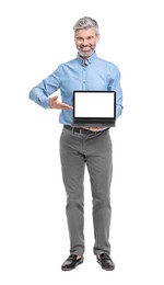 Mature businessman in stylish clothes with laptop on white background