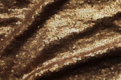 Photo of Beautiful golden sequin fabric as background, top view