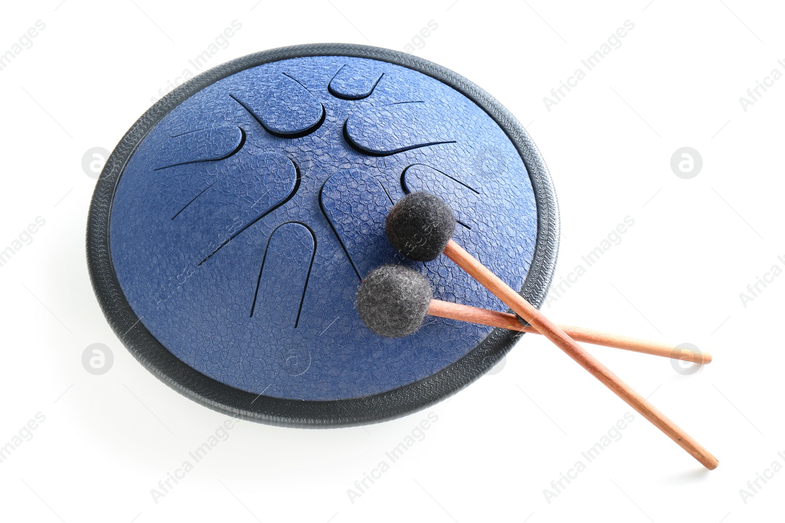 Photo of Steel tongue drum with soft mallets on white background. Percussion musical instrument