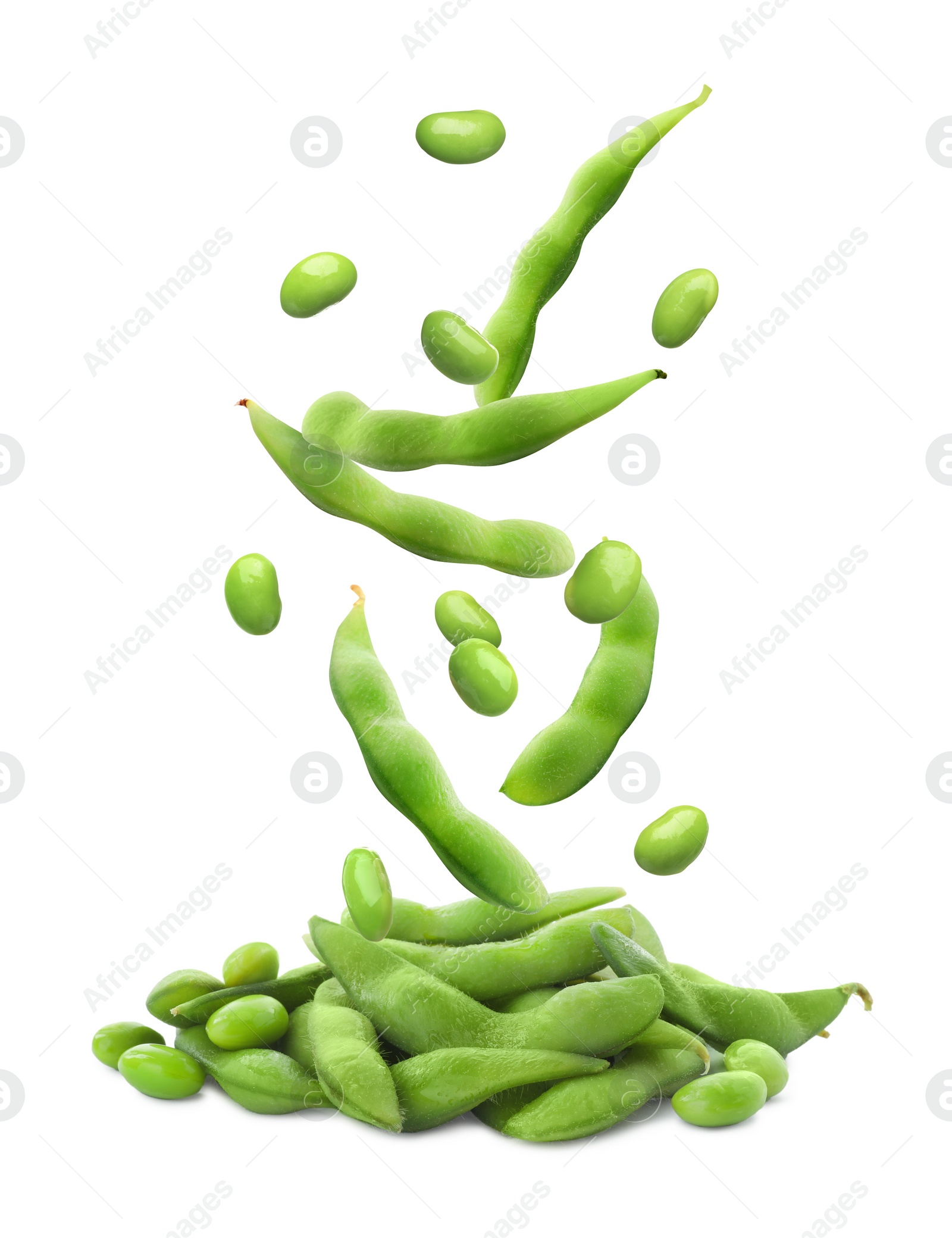 Image of Fresh edamame soybeans and pods falling onto pile against white background