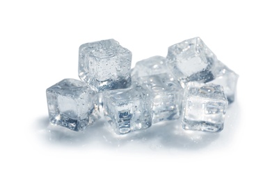 Photo of Pile of crystal clear ice cubes on white background