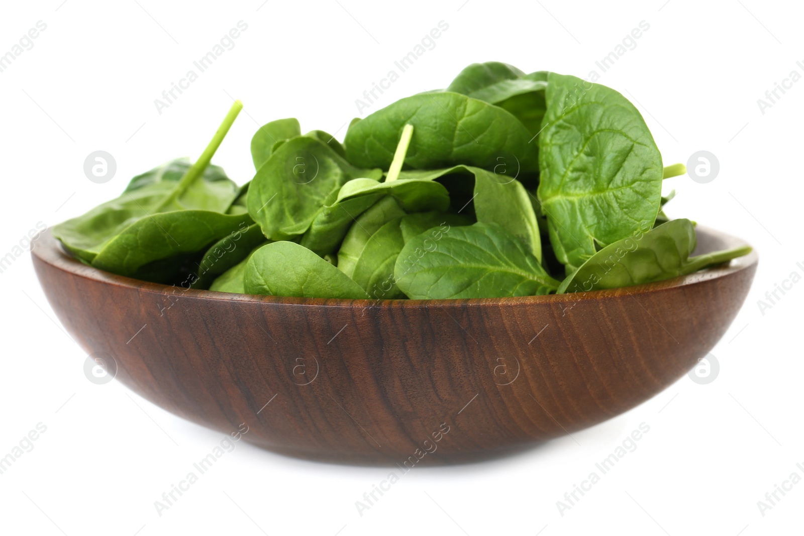 Photo of Bowl of spinach leaves isolated on white