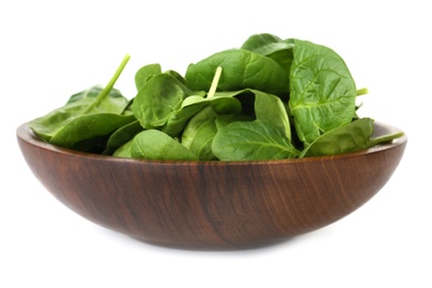 Photo of Bowl of spinach leaves isolated on white